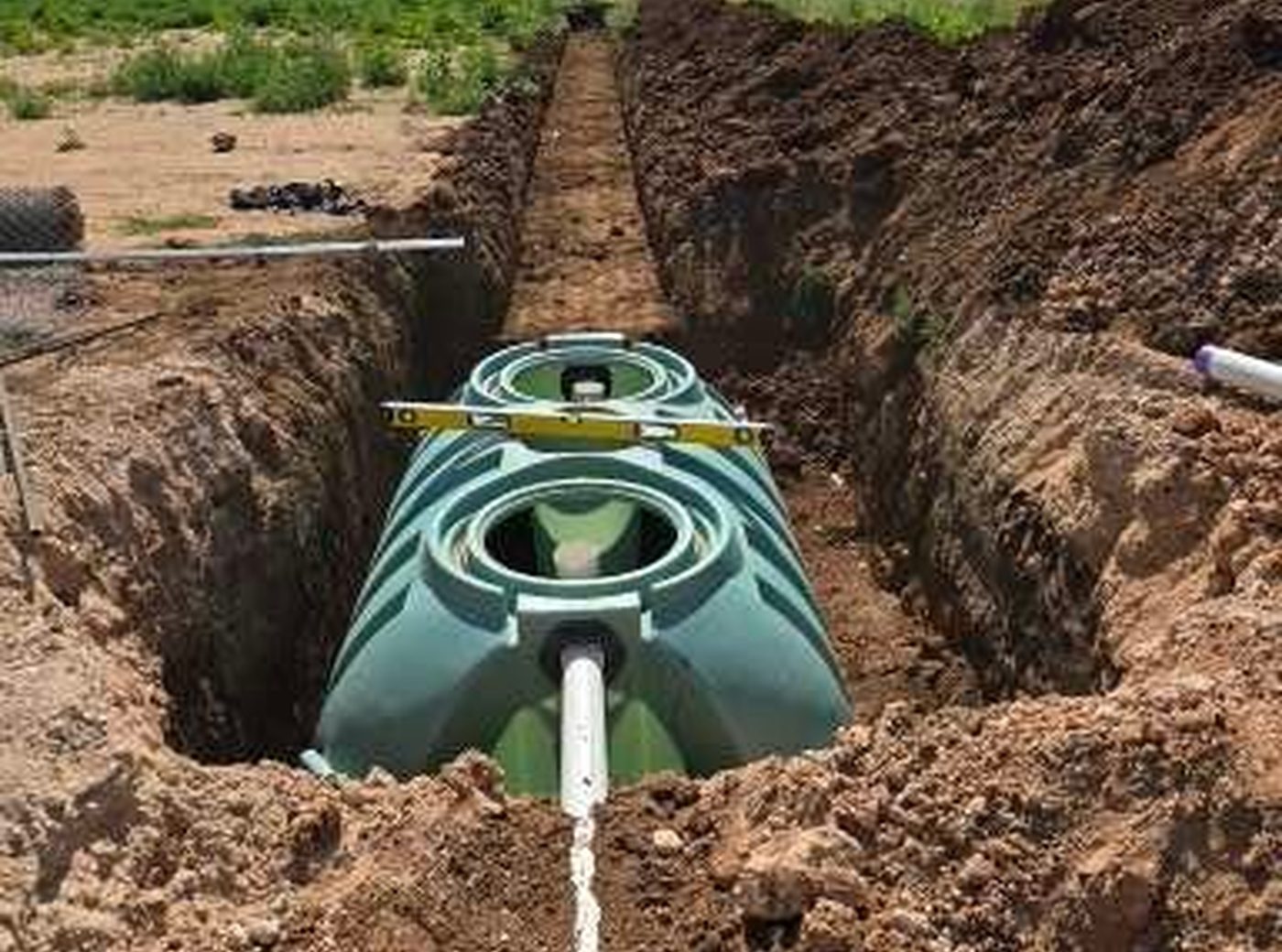 Septic tank and lines set in an open trench