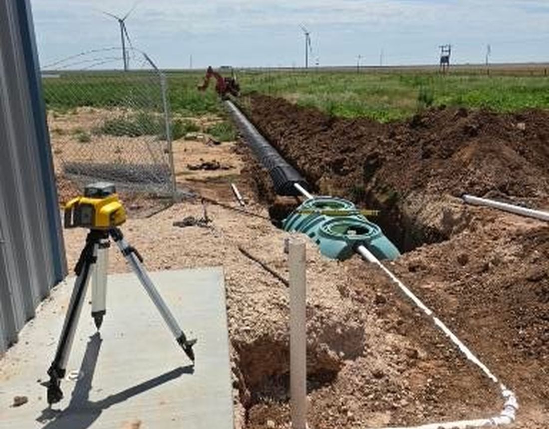 Drain line run to grade with a laser level set up